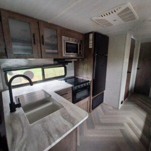 Picture of interior kitchen area of RV travel trailer for rent